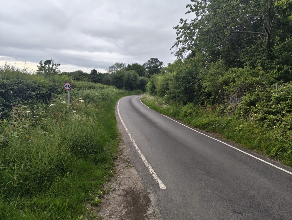 Cycle Route near Brockham showing road and trees. Reigate Newdigate, Brockham and Leigh cycle routes.